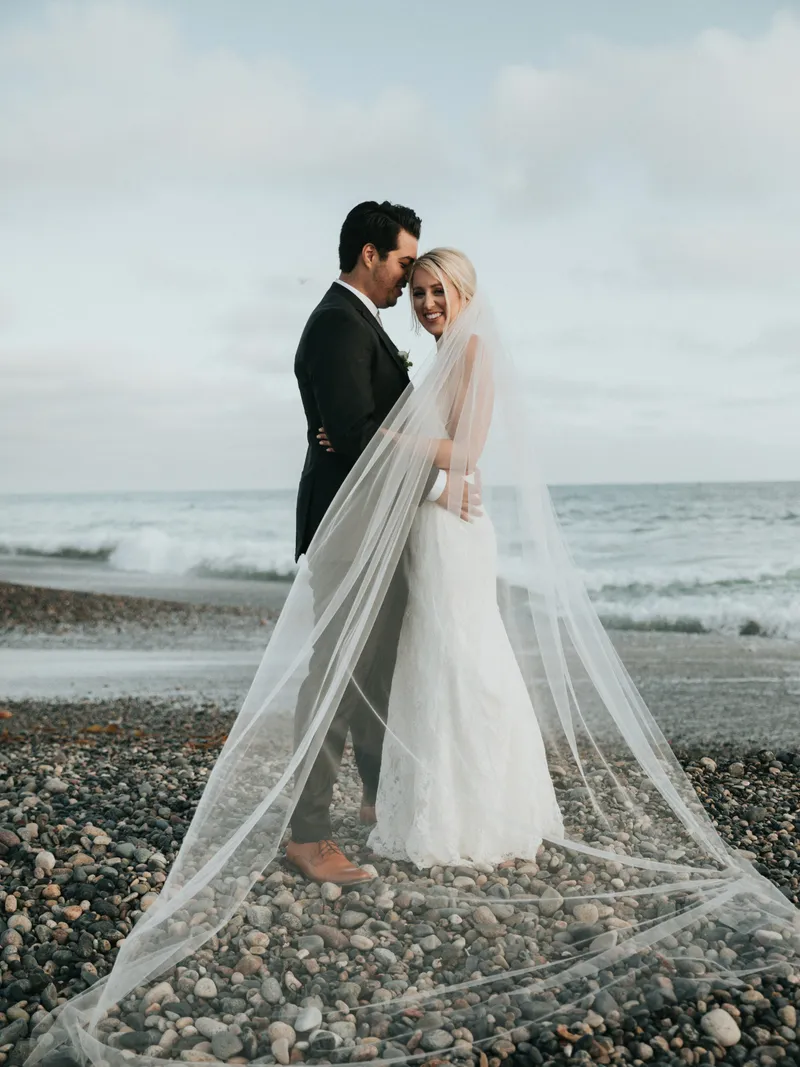 Bride with veil by the sea