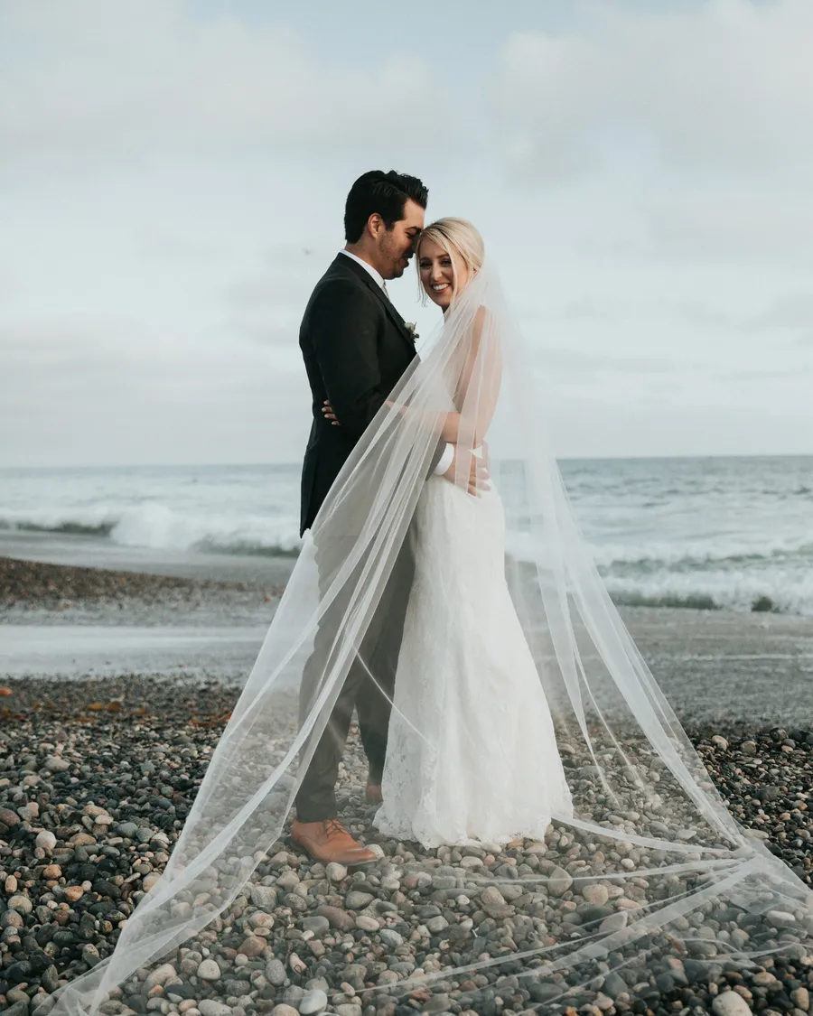Bride with veil by the sea