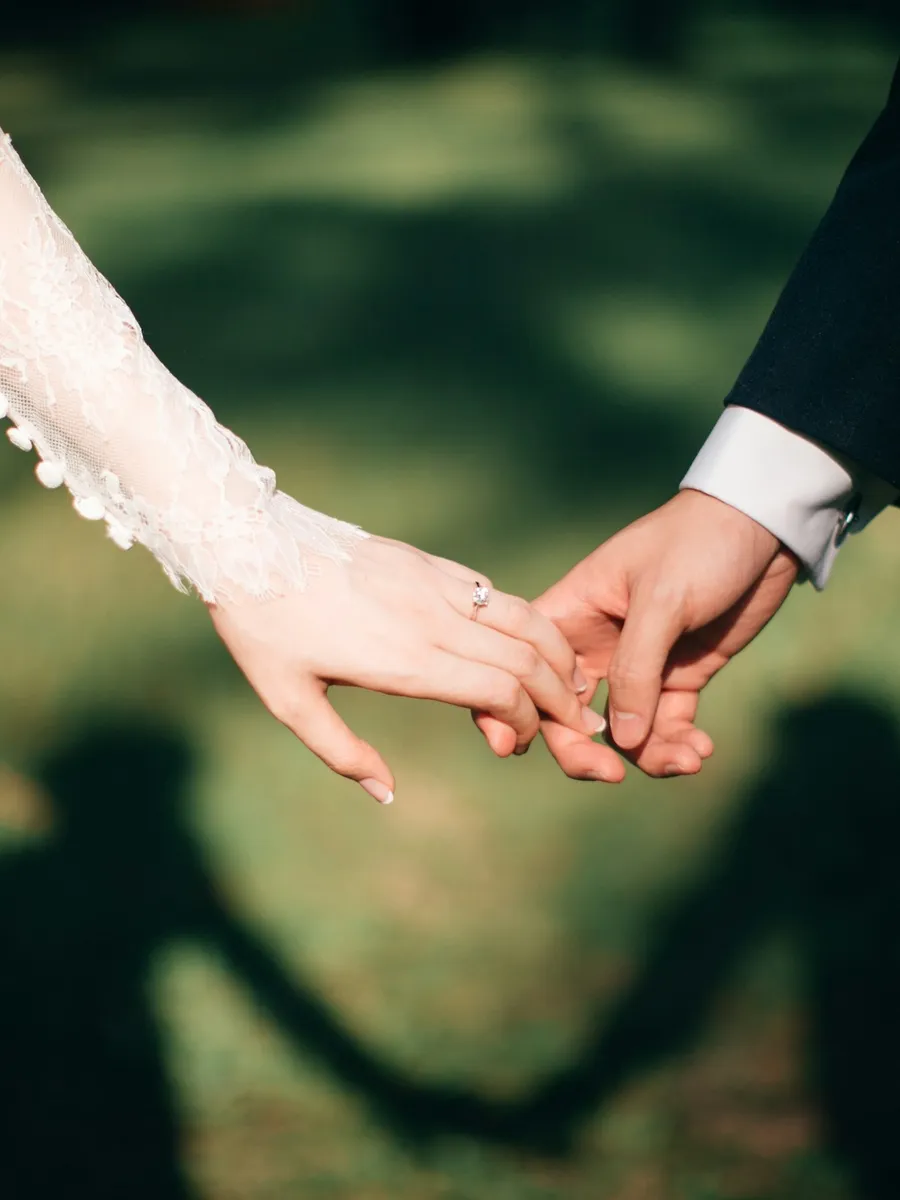 Couple holding hands at golden hour