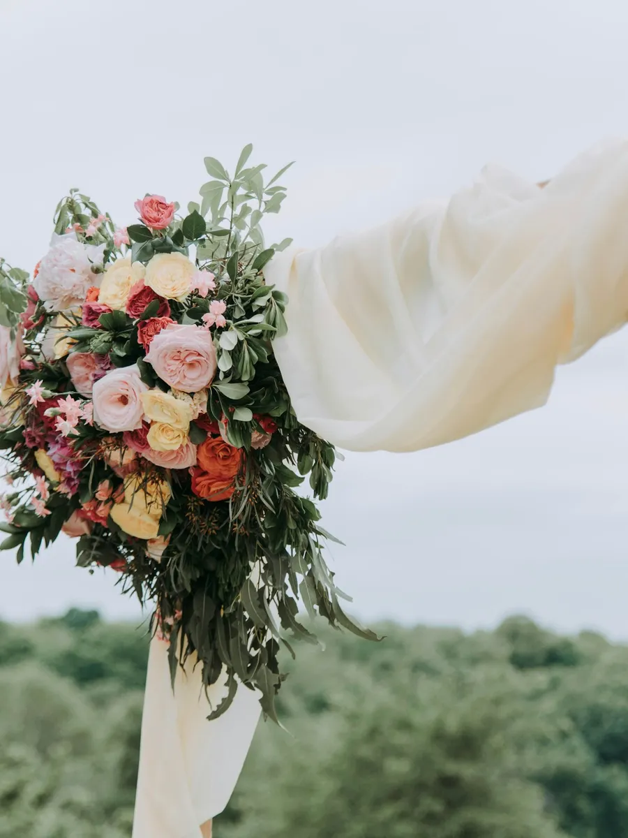Floral wedding arch in a garden