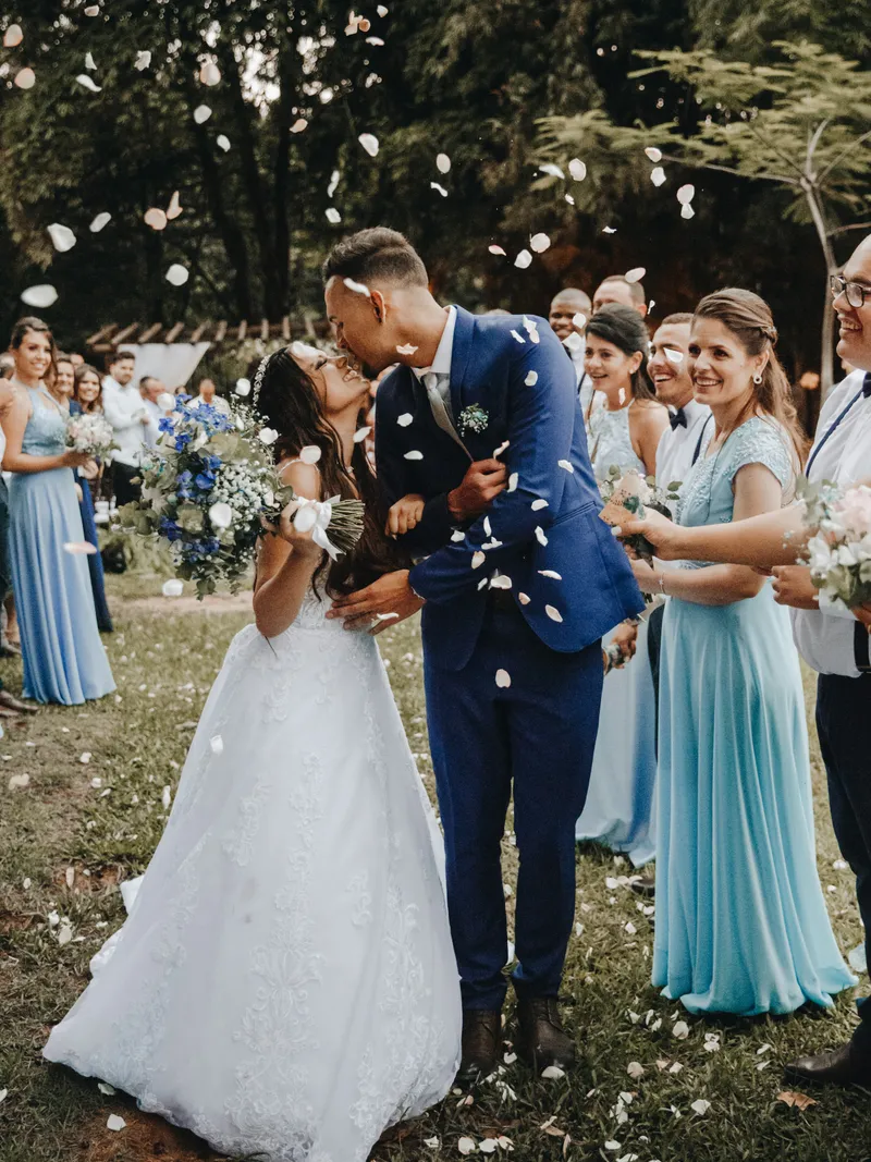 Newlyweds under falling confetti