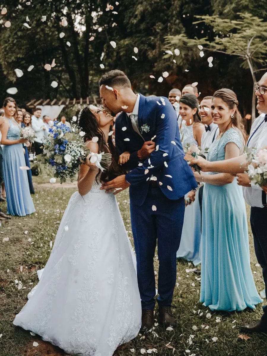 Newlyweds under falling confetti